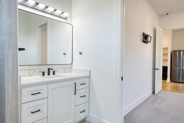 2420 Sumpter St, Houston, TX 77026 - bathroom with baseboards and vanity