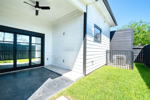 2420 Sumpter St, Houston, TX 77026 - property entrance featuring a lawn, a ceiling fan, fence, and a patio
