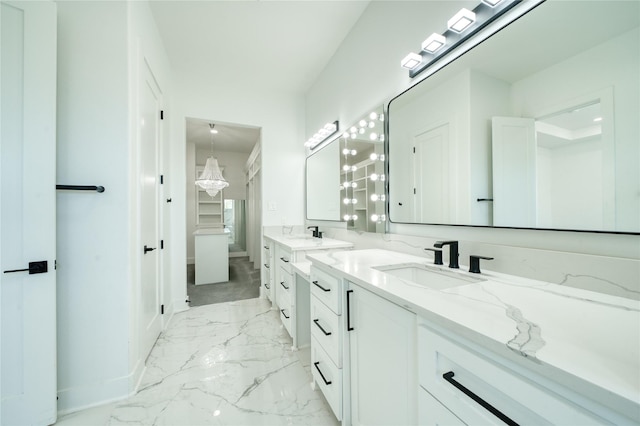 2420 Sumpter St, Houston, TX 77026 - full bathroom with a sink, baseboards, two vanities, and marble finish floor