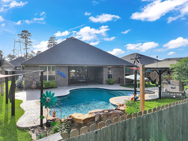 view of swimming pool featuring a patio, a gazebo, a fenced in pool, and fence