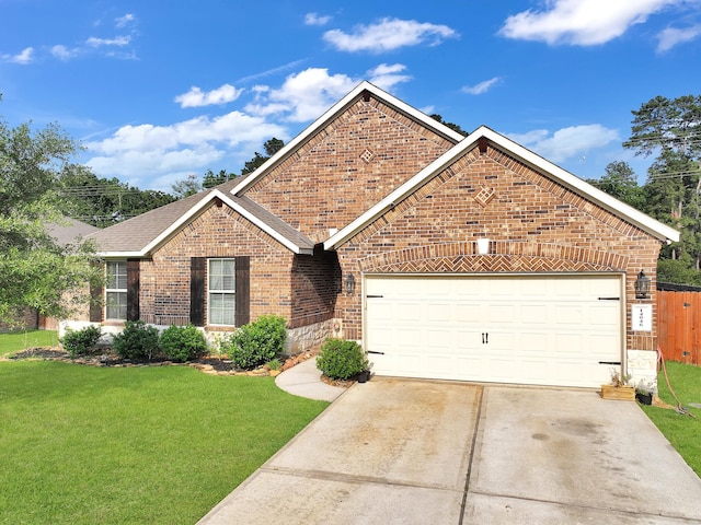 single story home featuring fence, a front yard, brick siding, an attached garage, and driveway