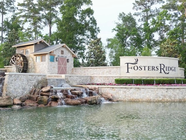 community sign with a water view