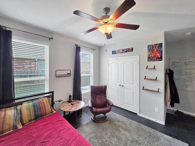 bedroom with baseboards and ceiling fan