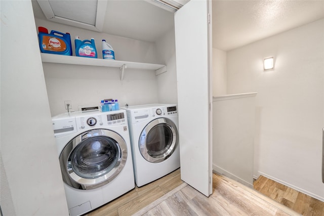 10912 Gulf Fwy Unit 28, Houston, TX 77034 - washroom featuring washing machine and dryer and light wood finished floors