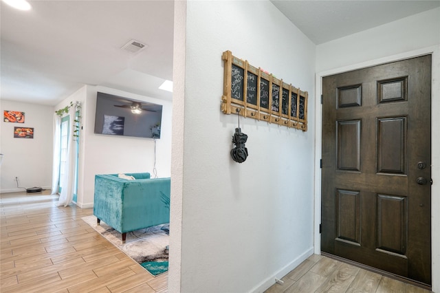 10912 Gulf Fwy Unit 28, Houston, TX 77034 - entryway featuring light wood-type flooring, baseboards, and ceiling fan