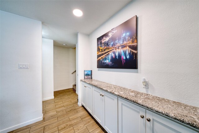 10912 Gulf Fwy Unit 28, Houston, TX 77034 - hallway featuring light wood-type flooring and baseboards