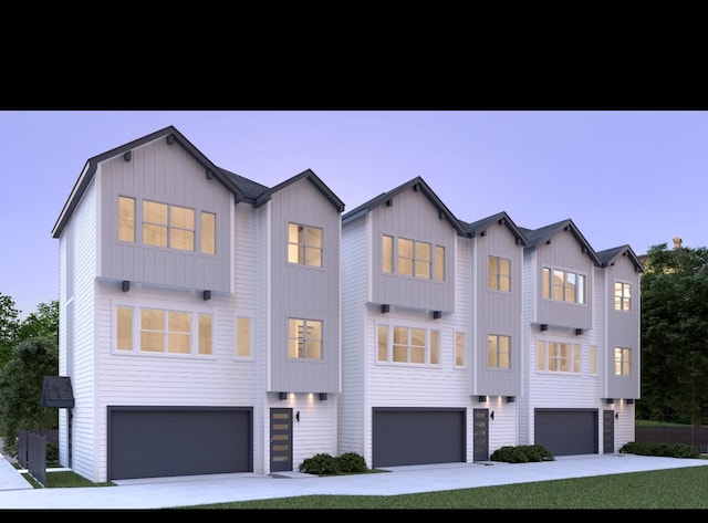 view of front of house with board and batten siding and an attached garage
