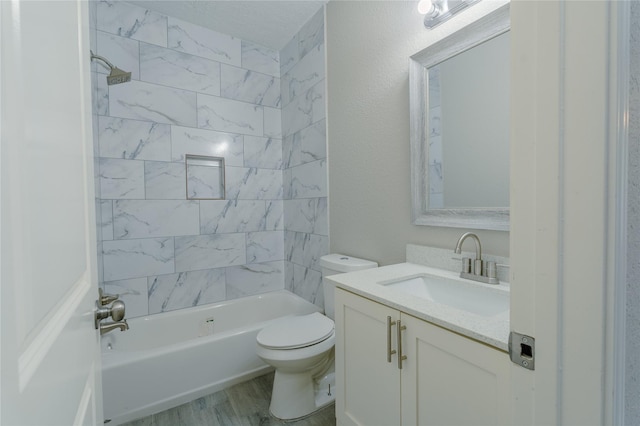 full bath featuring vanity, toilet, wood finished floors, and  shower combination