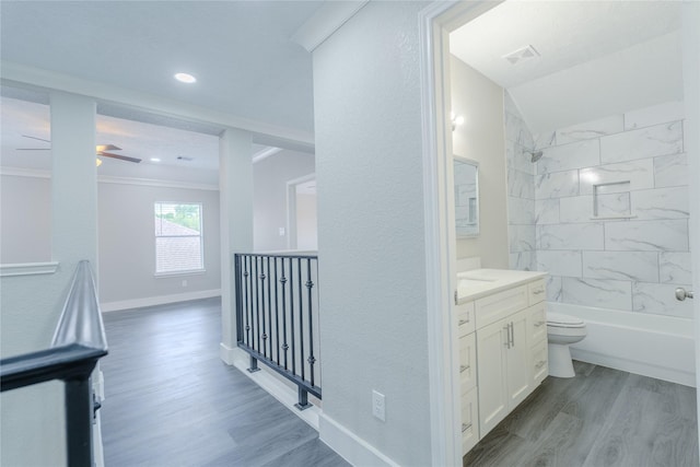full bathroom featuring visible vents, shower / tub combination, wood finished floors, vanity, and toilet