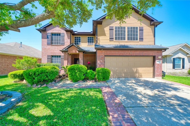 traditional-style home with a garage, concrete driveway, solar panels, and brick siding