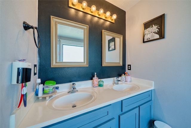 bathroom featuring double vanity and a sink