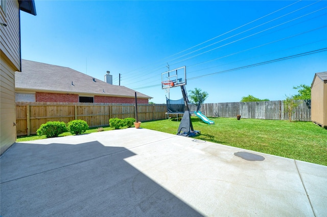 view of patio / terrace with a fenced backyard and a trampoline