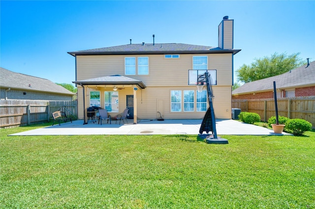 back of house featuring a patio, a fenced backyard, a chimney, and central AC unit
