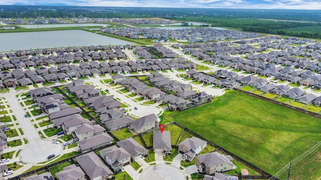 aerial view featuring a water view and a residential view