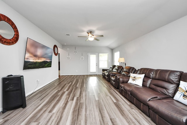 living room featuring baseboards, a ceiling fan, wood finished floors, and visible vents