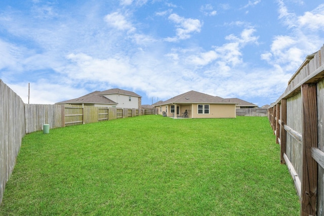 view of yard featuring a fenced backyard
