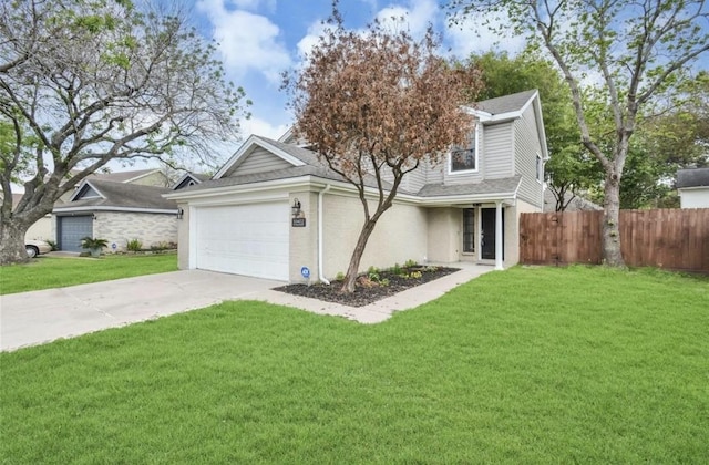 traditional-style house with fence, concrete driveway, a front lawn, and a garage