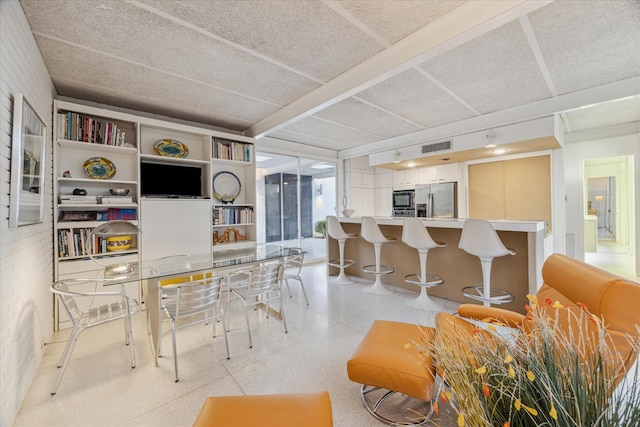 dining room with visible vents