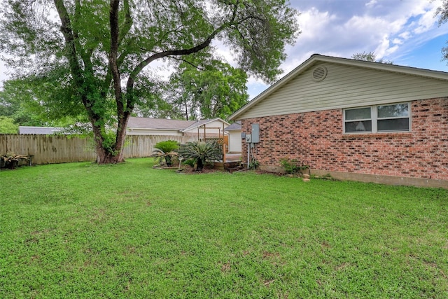 view of yard with fence