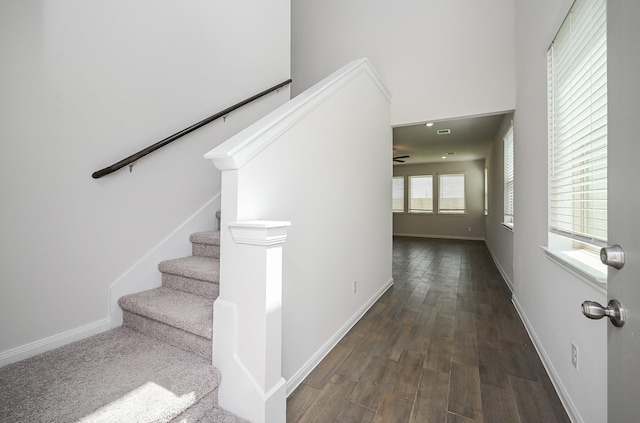 interior space featuring baseboards and wood finished floors