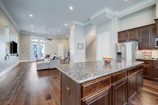 2125 Mcilhenny St, Houston, TX 77004 - kitchen with stainless steel refrigerator with ice dispenser, ceiling fan, recessed lighting, and dark wood-type flooring