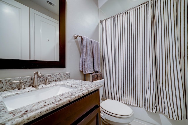 2125 Mcilhenny St, Houston, TX 77004 - bathroom featuring visible vents, shower / tub combo with curtain, toilet, and vanity