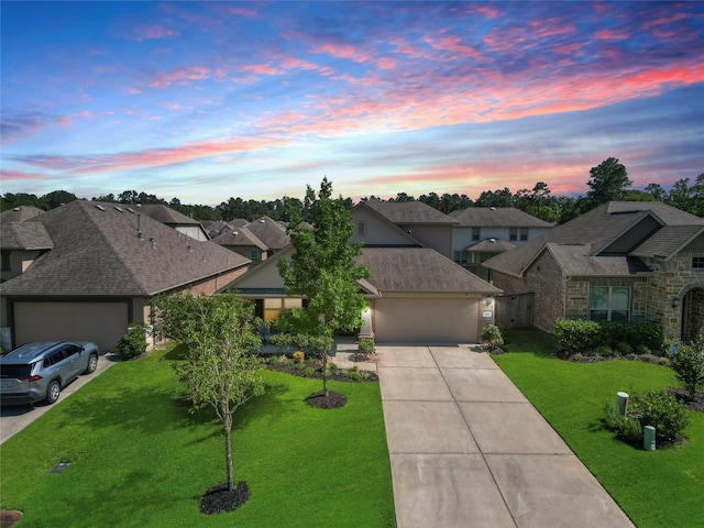 view of front of property with a residential view, an attached garage, concrete driveway, and a front lawn