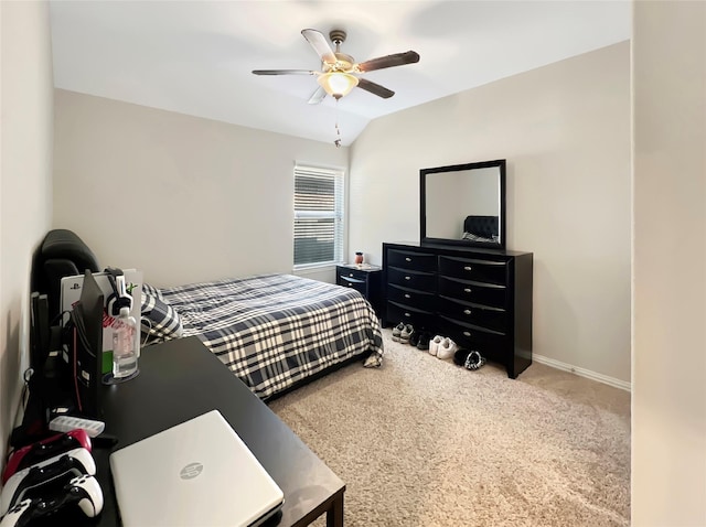 carpeted bedroom featuring baseboards, a ceiling fan, and lofted ceiling