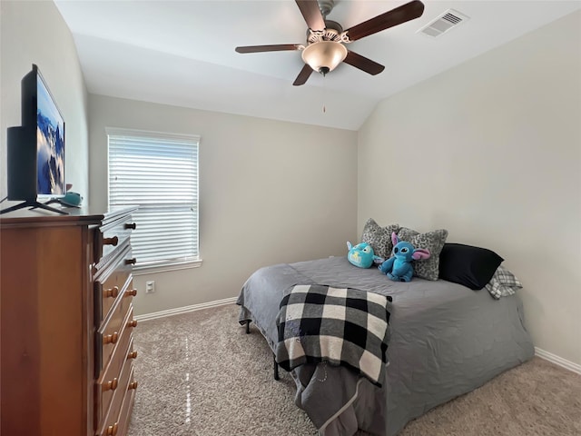 carpeted bedroom with baseboards, ceiling fan, vaulted ceiling, and visible vents
