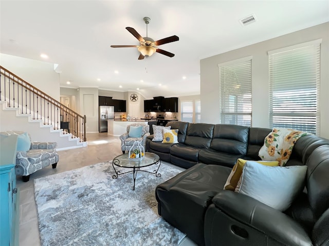 living room featuring recessed lighting, ceiling fan, stairs, and visible vents