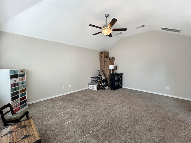 interior space featuring carpet flooring, ceiling fan, baseboards, lofted ceiling, and visible vents