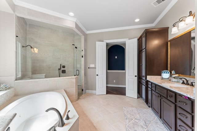 bathroom featuring a garden tub, crown molding, visible vents, and a shower stall