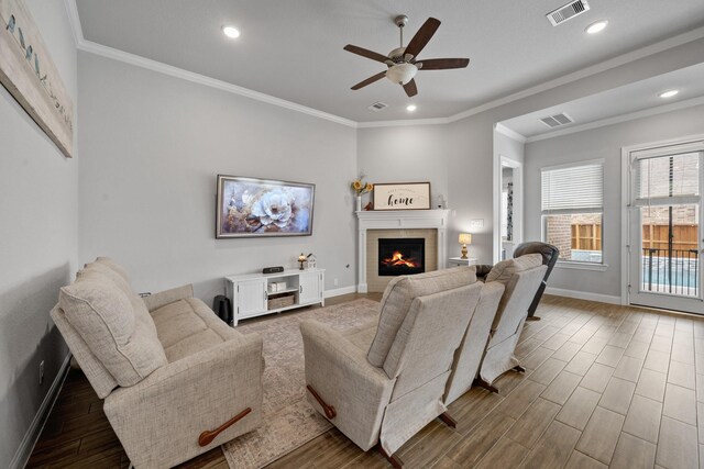4381 Victoria Pine Dr, Spring, TX 77386 - living room featuring a ceiling fan, baseboards, a fireplace, wood finished floors, and recessed lighting