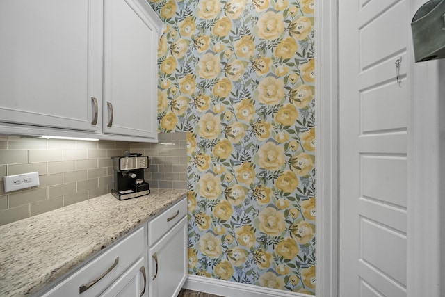 4381 Victoria Pine Dr, Spring, TX 77386 - kitchen with tasteful backsplash, white cabinets, and light stone counters