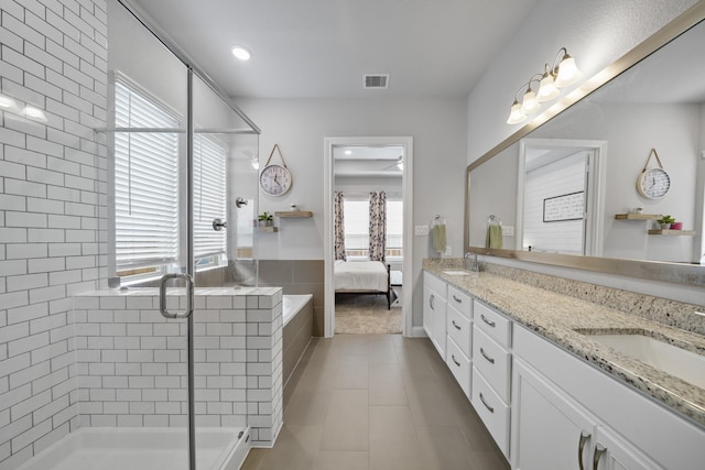 4381 Victoria Pine Dr, Spring, TX 77386 - bathroom with ensuite bath, a shower stall, tile patterned flooring, and double vanity
