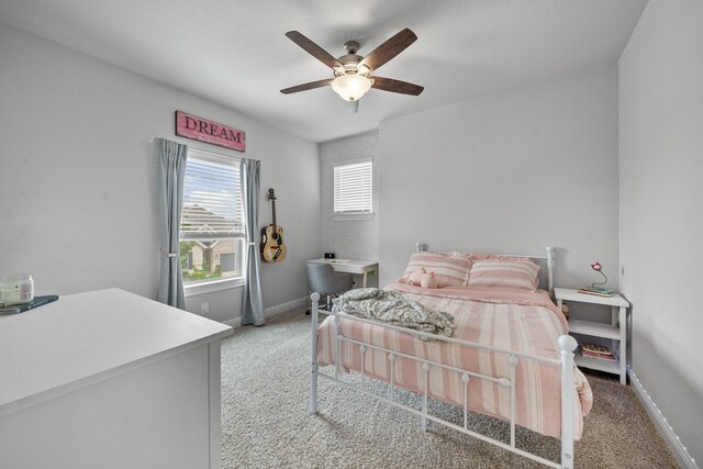 4381 Victoria Pine Dr, Spring, TX 77386 - bedroom with light colored carpet, a ceiling fan, and baseboards