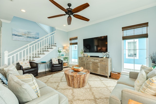 living room featuring ornamental molding, stairs, wood finished floors, recessed lighting, and a ceiling fan