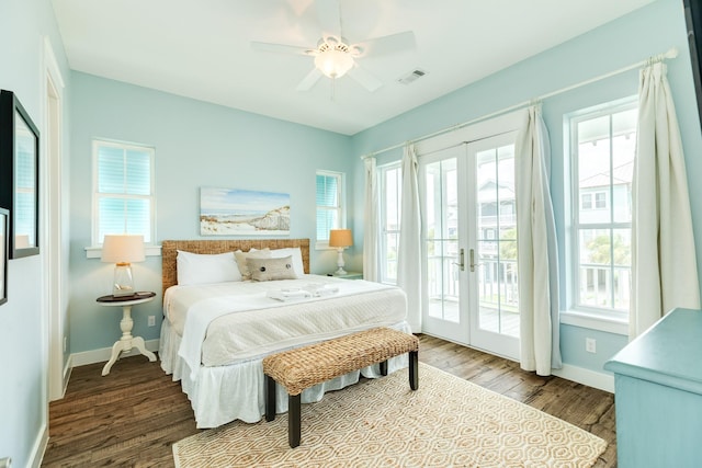 bedroom featuring visible vents, wood finished floors, baseboards, access to outside, and french doors