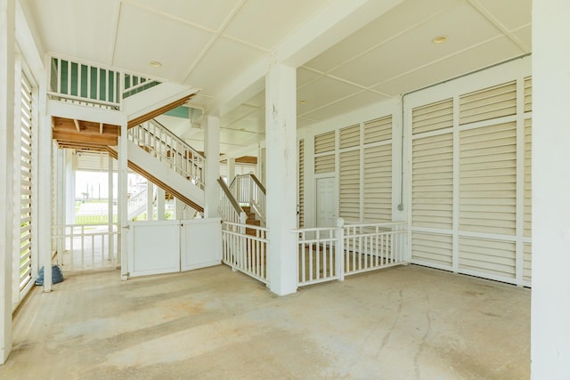 exterior space featuring unfinished concrete floors