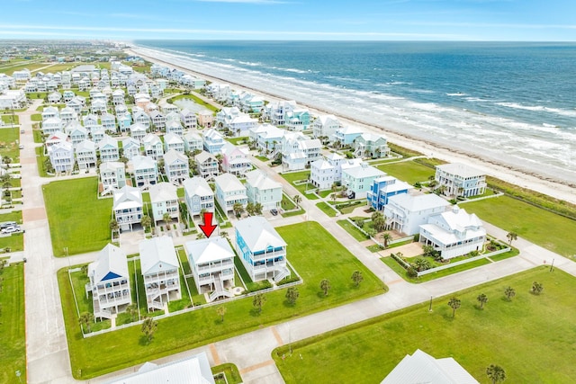 bird's eye view featuring a water view and a view of the beach