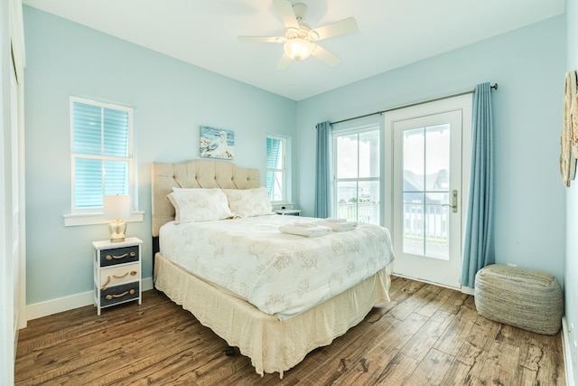 bedroom with dark wood-style flooring, baseboards, access to exterior, and ceiling fan