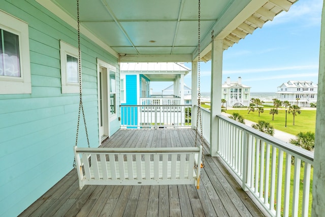 wooden terrace with a water view