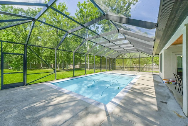 outdoor pool with a patio, a fenced backyard, a lanai, and a yard