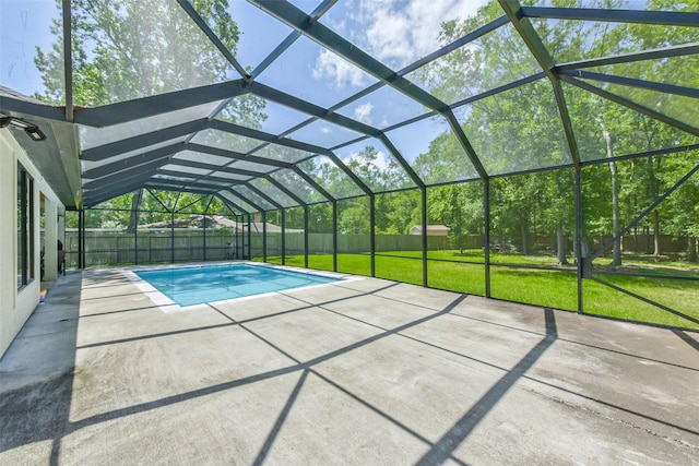 view of swimming pool featuring a fenced backyard, a fenced in pool, a patio area, glass enclosure, and a yard