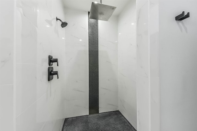 full bathroom featuring a marble finish shower