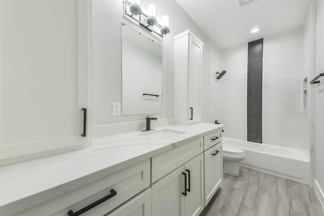 bathroom with toilet, shower / bath combination with curtain, and vanity