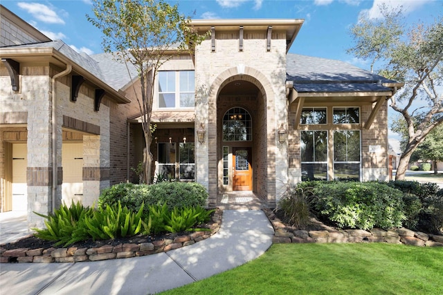 28202 Rippling Brook Ln, Fulshear, TX 77441 - entrance to property with a shingled roof and brick siding