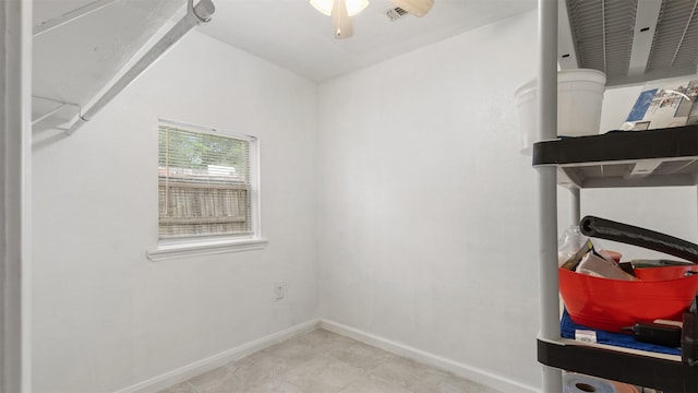 storage area featuring visible vents and a ceiling fan