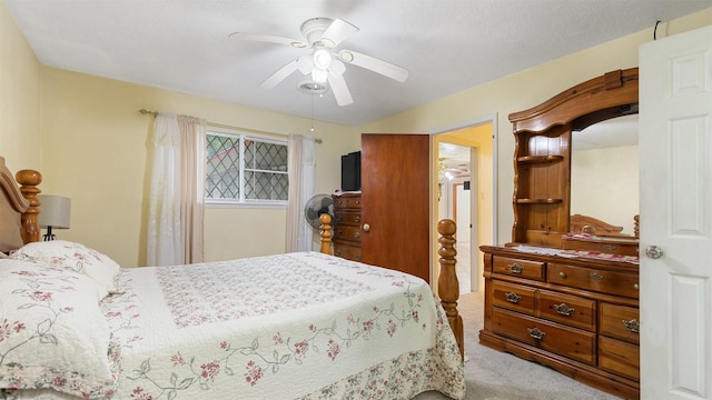 bedroom featuring ceiling fan and carpet