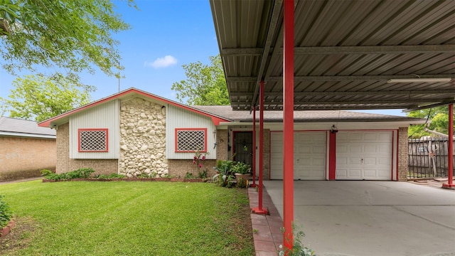 exterior space featuring brick siding, a yard, driveway, and a carport